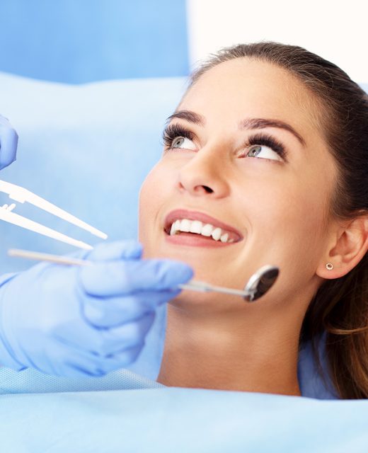 Adult woman having a visit at the dentist's